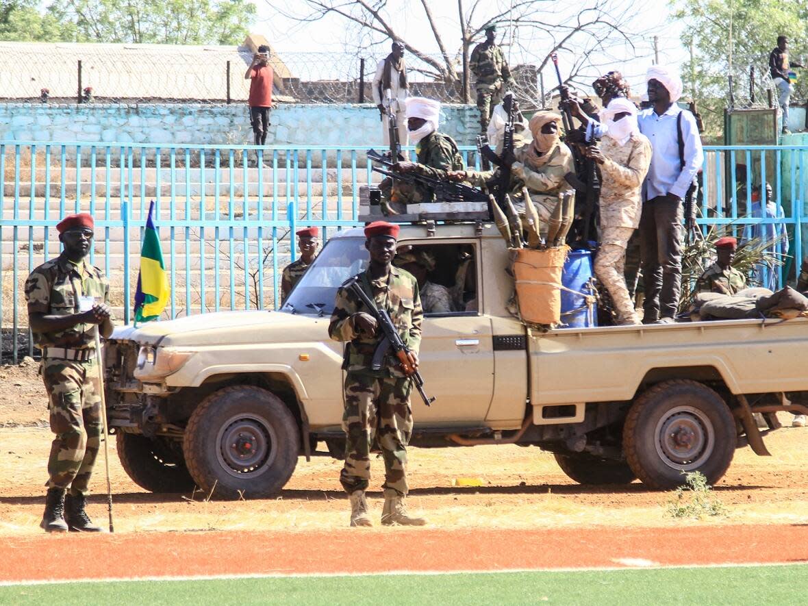 Fighters of the Sudan Liberation Movement, a rebel group active in Sudan's Darfur State that supports army chief Abdel Fattah al-Burhan, attend a graduation ceremony in southeastern Gedaref state on March 28, 2024.   (AFP via Getty Images - image credit)