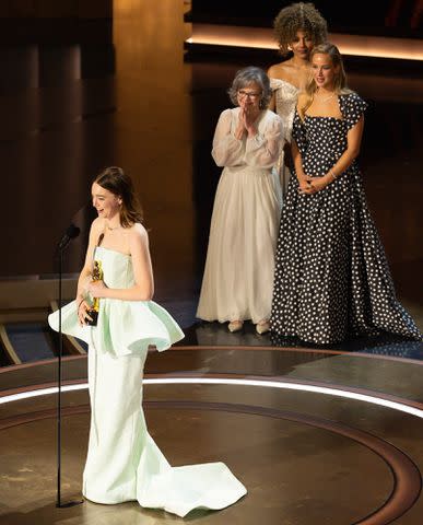 <p>Stewart Cook/Disney via Getty Images</p> Emma Stone accepting her Best Actress Oscar at the 2024 Oscars