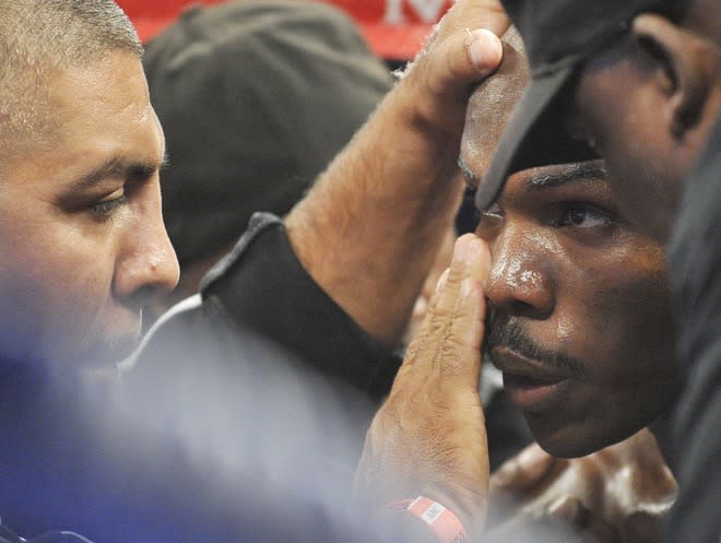 Timothy Bradley (R) of the US speaks with his corner men during their WBO welterweight title match against Manny Pacquiao of the Philippines at the MGM Grand Arena on June 9, 2012 in Las Vegas, Nevada. In what is being viewed as a highly controversial and unpopular outcome, unbeaten Bradley ended Pacquiao's long unbeaten run with a split decision victory over the Filipino ring icon. AFP PHOTO / JOE KLAMARJOE KLAMAR/AFP/GettyImages