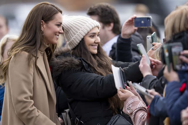 Mark Cuthbert/UK Press via Getty Images Kate Middleton smiles for a selfie in Scarborough on Nov. 3, 2022