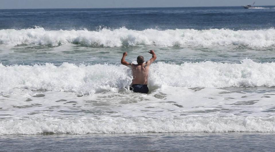 A man takes a dip in the Atlantic Ocean at Ogunquit Beach on Thursday, Sept. 15.