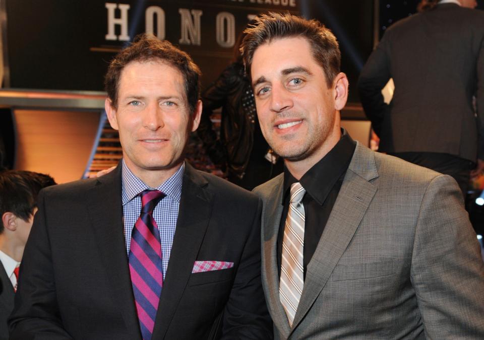 Aaron Rodgers, right, soon will passing the career passing totals of Steve Young, left (AP).