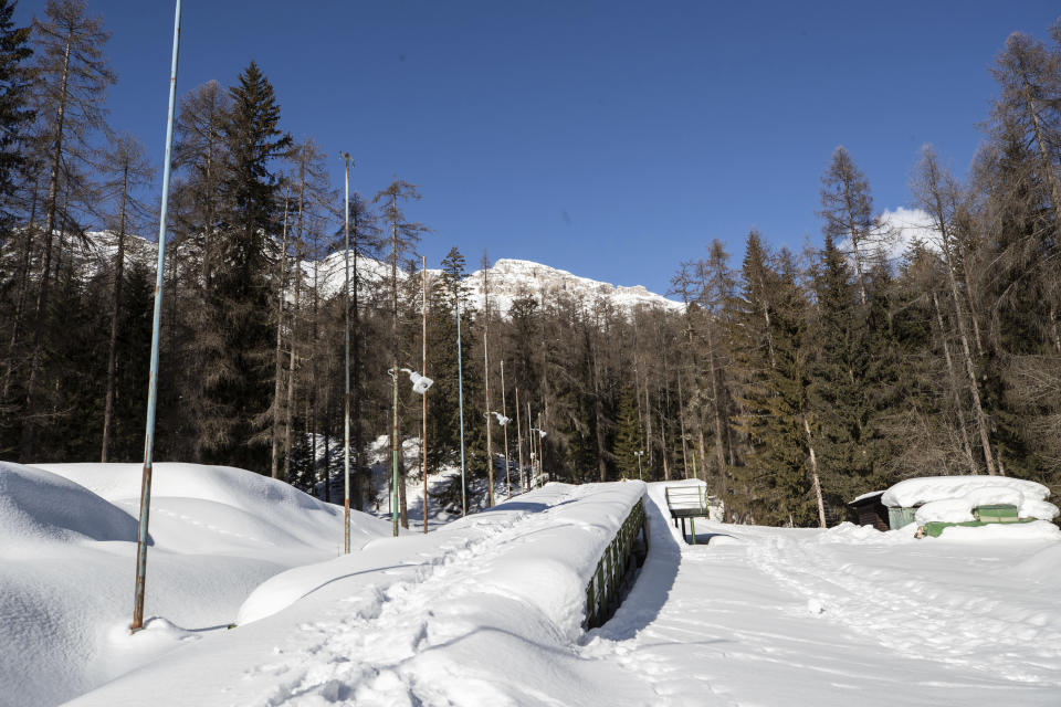 A view of the bobsled track in Cortina d'Ampezzo, Italy, Wednesday, Feb. 17, 2021. Bobsledding tradition in Cortina goes back nearly a century and locals are hoping that the Eugenio Monti track can be reopened for the 2026 Olympics in the Italian resort. (AP Photo/Gabriele Facciotti)