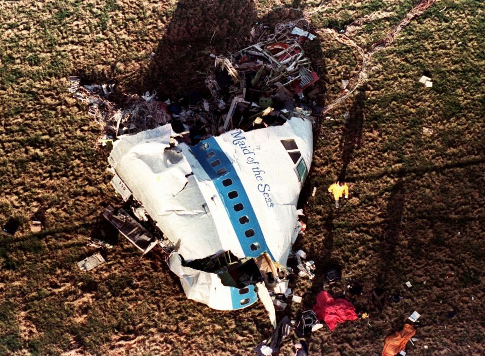 FILE - In this Dec. 22, 1988 file photo the nose section of Pan Am Flight 103, a 747 airliner dubbed "The Maid of the Sea," lies in a field outside the village of Lockerbie, Scotland. The United Kingdom has suffered its worst ever civilian loss of life since World War II, because of the coronavirus, with some 100,000 taken by the pandemic, a fearsome foe whose defeat is still some time away. (AP Photo/Martin Cleaver, File)