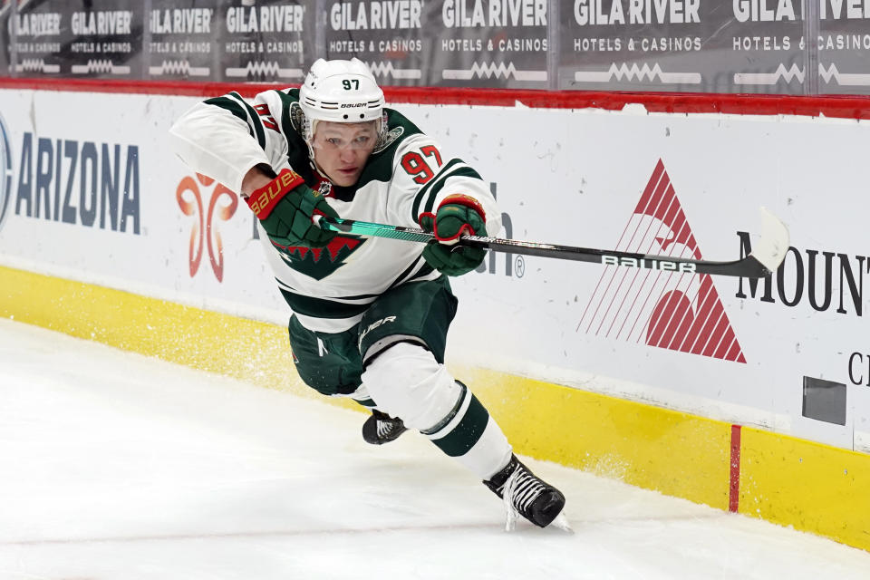 FILE - Minnesota Wild left wing Kirill Kaprizov (97) plays in the first period during an NHL hockey game against the Arizona Coyotes in Glendale, Ariz., in this Friday, March 5, 2021, file photo. After waiting five years for Kirill Kaprizov to leave Russia for the NHL, the Minnesota Wild's level of satisfaction with their floppy-haired, easy-smiling left wing has met the extraordinary expectations that surrounded his debut season. (AP Photo/Rick Scuteri, File)