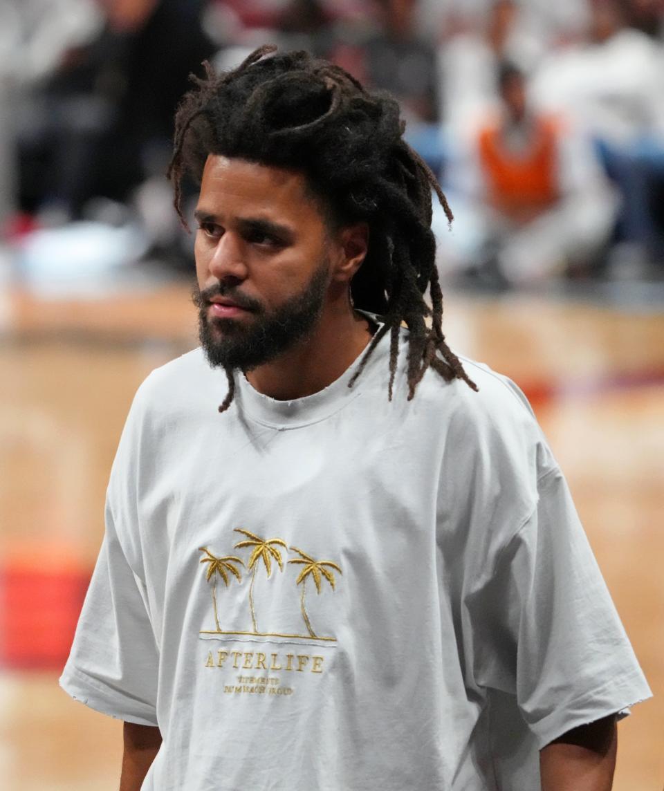 Recording artist J. Cole walks off the court after Game 3 of the 2023 NBA Finals between the Miami Heat and Denver Nuggets at Kaseya Center.