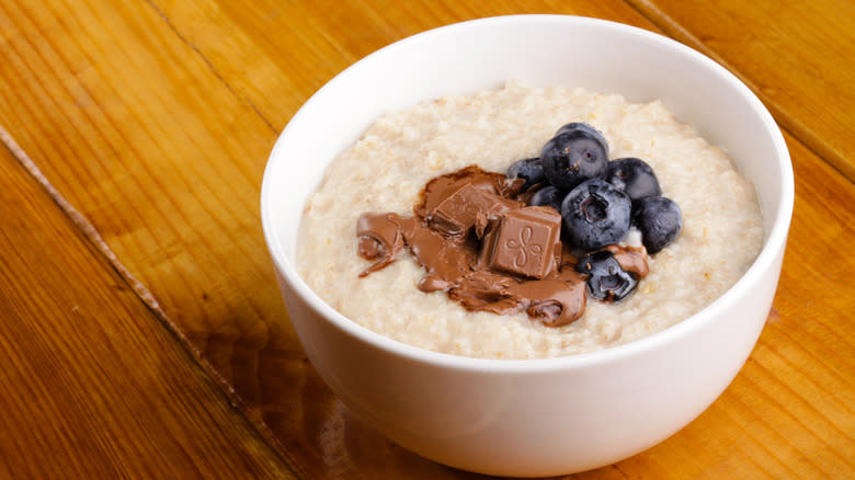 Melted chocolate and blueberries on oatmeal 