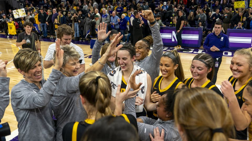 Clark celebrates with her coaches and teammates after the game. - Ben Hsu/Icon Sportswire/AP