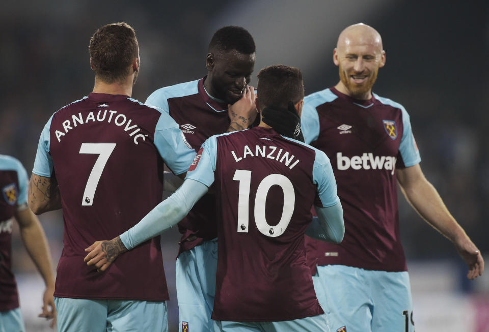 HUDDERSFIELD, ENGLAND – JANUARY 13: Manuel Lanzini of West Ham United celebrates scoring with Marko Arnautovic (L) Cheikhou Kouyate (2nd L) and James Collins (R) during the Premier League match between Huddersfield Town and West Ham United at John Smith’s Stadium on January 13, 2018 in Huddersfield, England. (Photo by Arfa Griffiths/West Ham United via Getty Images)