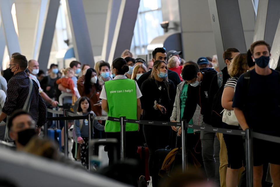 Queues of people are seen at Sydney Domestic Airport on Thursday. Source: AAP