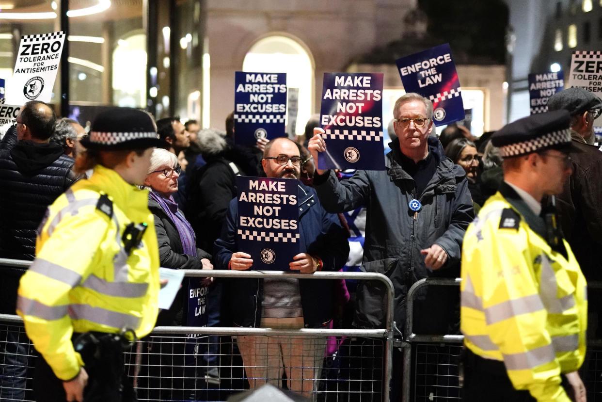 People attend a Campaign Against Antisemitism rally outside New Scotland Yard in central London on Wednesday. (PA)