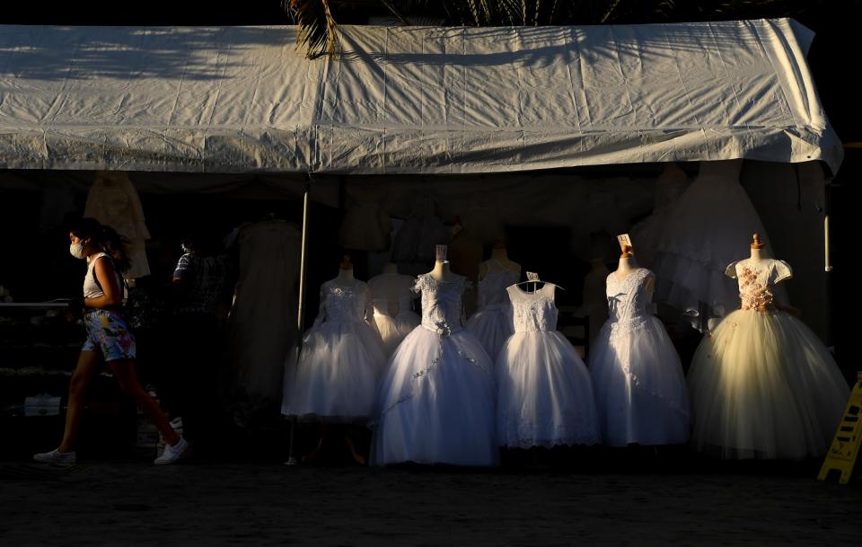 A shopper walks out of Angel's Bridal at the Plaza Mexico in Lynwood.