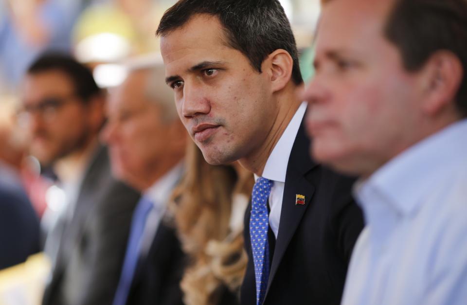 FILE - In this Feb. 21, 2020 file photo, opposition leader Juan Guaido meets with union workers and supporters in Caracas, Venezuela. A British judge on Thursday July 2, 2020, refused to give Venezuela control of over $1 billion in gold sitting in a Bank of England vault, ruling that it is unlawful to give it to the President Nicolas Maduro since Britain does not recognize him as the president. Maduro has demanded the gold to help his cash-starved nation fight the coronavirus pandemic. (AP Photo/Ariana Cubillos, File)