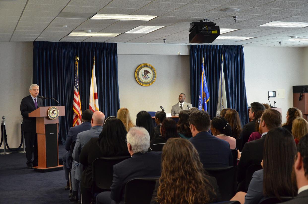 Attorney General Merrick Garland, at podium, visited the U.S. Attorney’s Office for the Southern District of Florida in Miami on Oct. 19, 2023. During the visit, Garland held a roundtable meeting with U.S. Attorney Markenzy Lapointe, seated on right, and several local law enforcement partners.