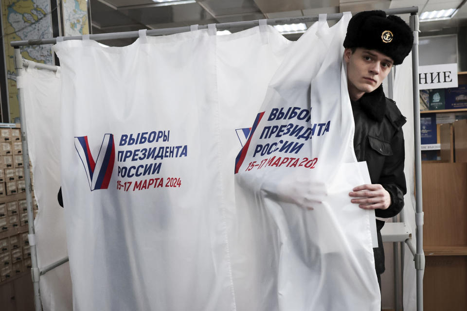 Voters in Russia are heading to the polls for a presidential election that is all but certain to extend President Vladimir Putin's rule after he clamped down on dissent.  (AP)