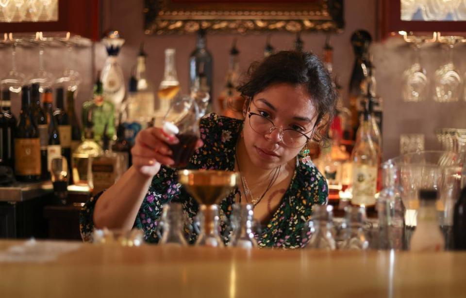 Caitlin Britt mixes a drink at the Lula Drake Wine Parlour in Columbia on Tuesday, March 26, 2024. The Lula Drake Wine Parlour is a semifinalist for a 2024 James Beard Award.