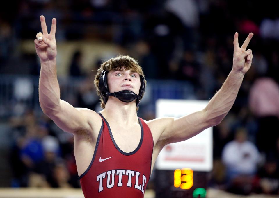 Tuttle's Beau Hickman celebrates during the Class 4A 138-pound title match at the state tournament on Feb. 25 at State Fair Arena.