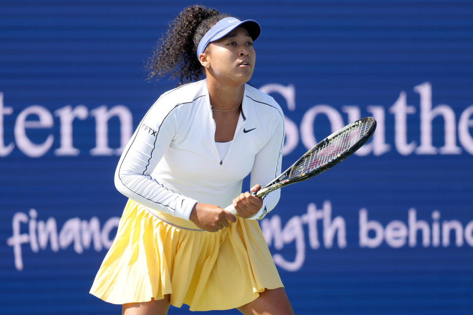 MASON, OHIO - AUGUST 16: Naomi Osaka of Japan returns a shot to Shuai Zhang of China during the Western & Southern Open at Lindner Family Tennis Center on August 16, 2022 in Mason, Ohio. (Photo by Matthew Stockman/Getty Images)