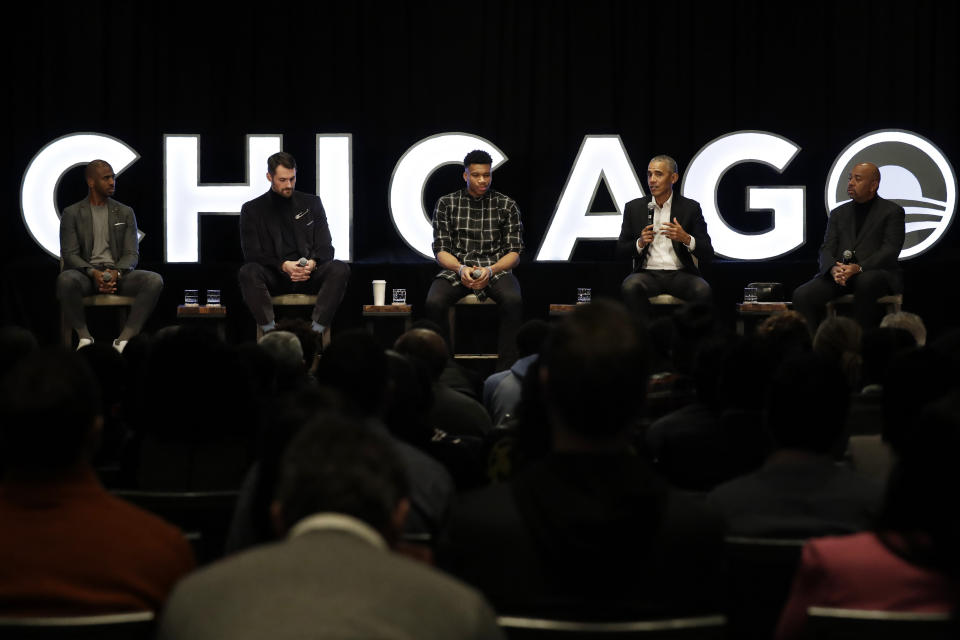 Former President Barack Obama, second from right, talks as Chris Paul, left, of the Oklahoma City Thunder, Kevin Love, second from left, of the Cleveland Cavaliers, Giannis Antetokounmpo, center, of the Milwaukee Bucks, and sports analyst Michael Wilbon listen during a conversation on community impact fireside chat in Chicago, Saturday, Feb. 15, 2020. Obama Foundation to host conversation on community impact with former President Obama and NBA stars. (AP Photo/Nam Y. Huh)