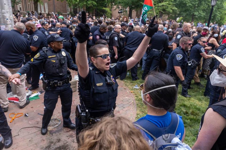 Pro-Palestinian demonstrators clash with police after replacing an American flag with a Palestinian flag Tuesday, April 30, 2024 at UNC-Chapel Hill. Police removed a “Gaza solidarity encampment” earlier Tuesday morning.