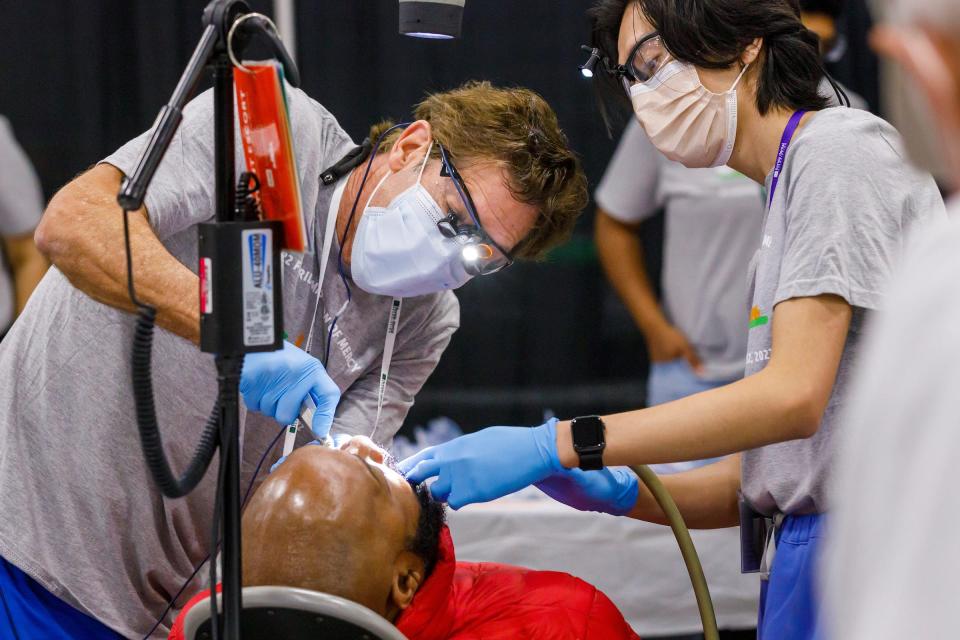 A patient is treated at the Civic Center during the Florida Dental Association Foundation Florida Mission of Mercy Friday in Tallahassee on March 11, 2022.