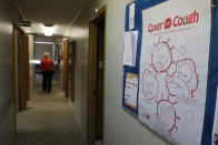 A sign is posted in the Decatur County Health Department building urging residents to cover your mouth while coughing, Thursday, April 2, 2020, in Greensburg, Ind. Three southeast Indiana counties have among the highest per-capita coronavirus infection rates in the country. (AP Photo/Darron Cummings)