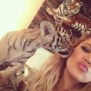Khloe Kardashian just can't catch a break! After getting slammed for posting a pic of her wearing a niqab face covering during her trip to Dubai, Khloe also came under fire on Thursday when she posted a selfie of her cuddling with a tiger cub. <strong> PHOTOS: Stars Pose With Their Pets </strong> The image caused some uproar among those fighting for animal rights who felt the pic promoted the captivity of wild creatures. "We're disappointed to see yet another celebrity posing with a wild animal," Silia Smith of World Animal Protection told <em>Daily Mail</em>. "Tiger cubs belong in the wild, with their mothers -- not in captivity for use as entertainment or photo props." Khloe posed for pics with an array of animals, including snaps with a stingray and an orangutan, but it was the cub photo that seemed to anger activists the most. "Not slamming Khloe at all. I love her and her ethics. I hate the practice of animal exploitation and tourism," one commenter said of the image. "This is just disgusting," another Instagram user wrote. "And I was so disappointed to see you wearing fur in the last [ <em>Keeping Up with the Kardashians</em>] episode. I knew it was all marketing that your were 'against it' but still sad about it." <strong> WATCH: New <em>Keeping Up With The Kardashians</em> Preview Shows Terrifying Car Crash Footage </strong> "I thought you were against it? All for a photo op?" another comments reads. "Disgusting... You should be ashamed!!!" Meanwhile, Khloe's estranged husband Lamar Odom sent out his first tweet in nearly a year on Thursday. Sharing some artwork of himself on Instagram, the M.I.A. basketball pro wrote: "Appreciate the love." <strong> How do you feel about Khloe posing with a tiger cub? </strong> <em>For more on the 30-year-old reality star's other selfie controversy, check out this video:</em>