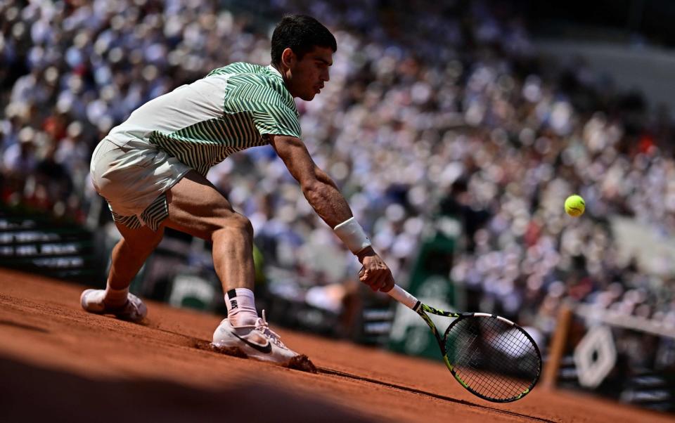 Alcaraz Garfia plays a forehand return to Serbia's Novak Djokovic during their men's singles semi-final match on day thirteen of Roland-Garros - JULIEN DE ROSA/AFP via Getty Images