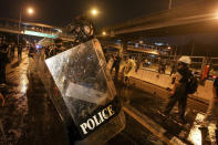 Police react with protesters during a protest in Bangkok, Thailand, Sunday, Feb. 28, 2021. (AP Photo)