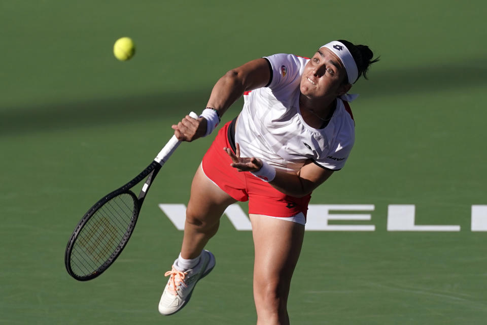 Ons Jabeur, of Tunisia, serves to Anett Kontaveit, of Estonia, at the BNP Paribas Open tennis tournament Thursday, Oct. 14, 2021, in Indian Wells, Calif. (AP Photo/Mark J. Terrill)