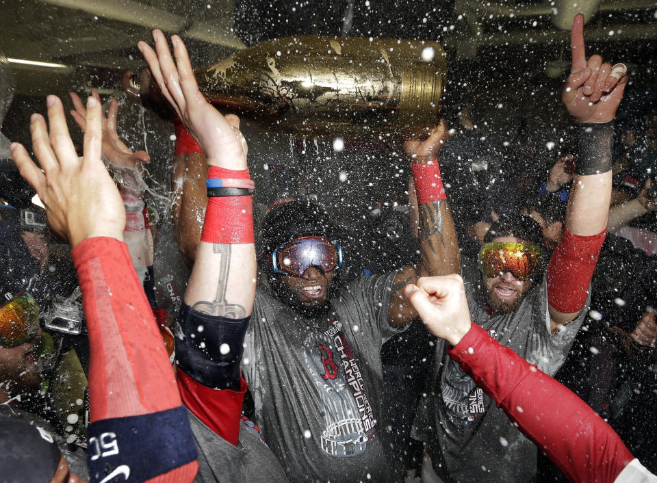 Boston Red Sox's David Ortiz celebrates with teammates after Game 6 of baseball's World Series against the St. Louis Cardinals Thursday, Oct. 31, 2013, in Boston. The Red Sox won 6-1 to win the series. Ortiz was names the series MVP. (AP Photo/David J. Phillip)