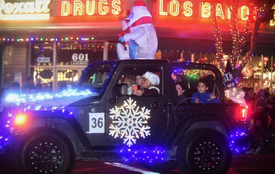 People lined up Main Street in Los Banos, Calif. for the Annual Christmas Parade on Friday, Dec. 3, 2021.