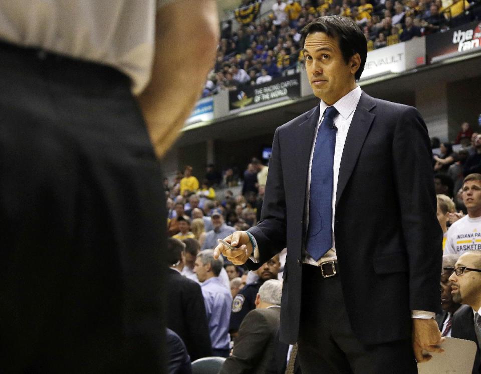 Miami Heat head coach Erik Spoelstra asks a question of an official during the second half of an NBA basketball game against the Indiana Pacers in Indianapolis, Wednesday, March 26, 2014. The Pacers won 84-83. (AP Photo/AJ Mast)