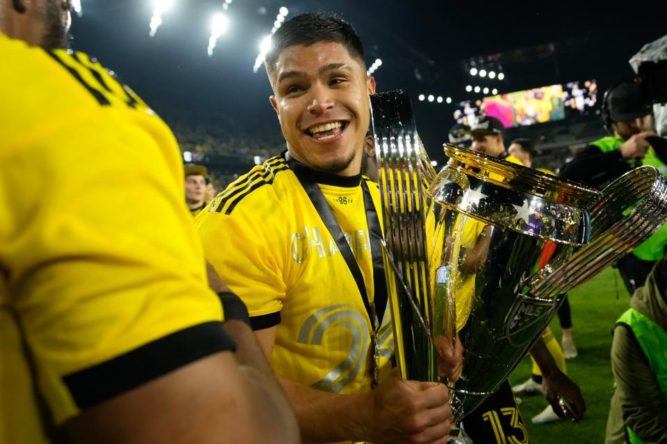 Dec 9, 2023; Columbus, OH, USA; Columbus Crew forward Cucho Hernandez (9) holds the Philip J. Anschutz Trophy following the 2-1 win over Los Angeles FC in the MLS Cup final at Lower.com Field.