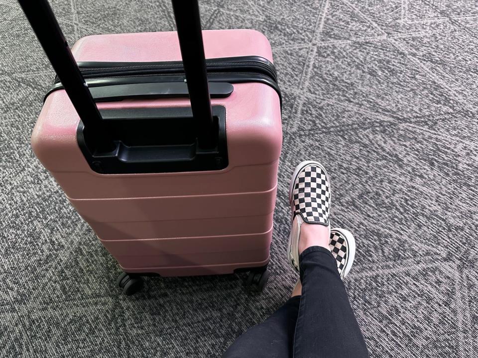 A suitcase and Vans sneakers.