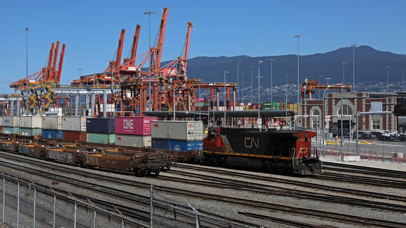 Containers and shipping cranes lie idle at the Port of Vancouver