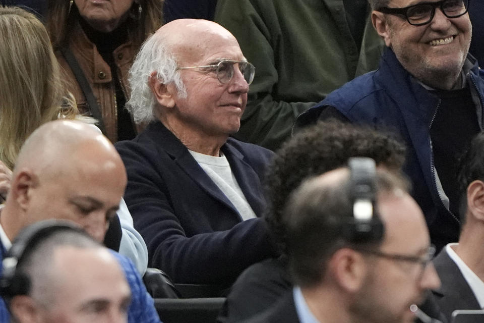 Actor Larry David watches from the stands as UConn and Illinois warms up prior to the first half of the Elite 8 college basketball game in the men's NCAA Tournament, Saturday, March 30, 2024, in Boston. (AP Photo/Michael Dwyer)