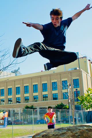 <p>Courtesy of Cloud Family</p> Angus Cloud skateboarding in 8th grade across the street from OSA (Oakland School for the Arts) that will eventually be Cloud Park.