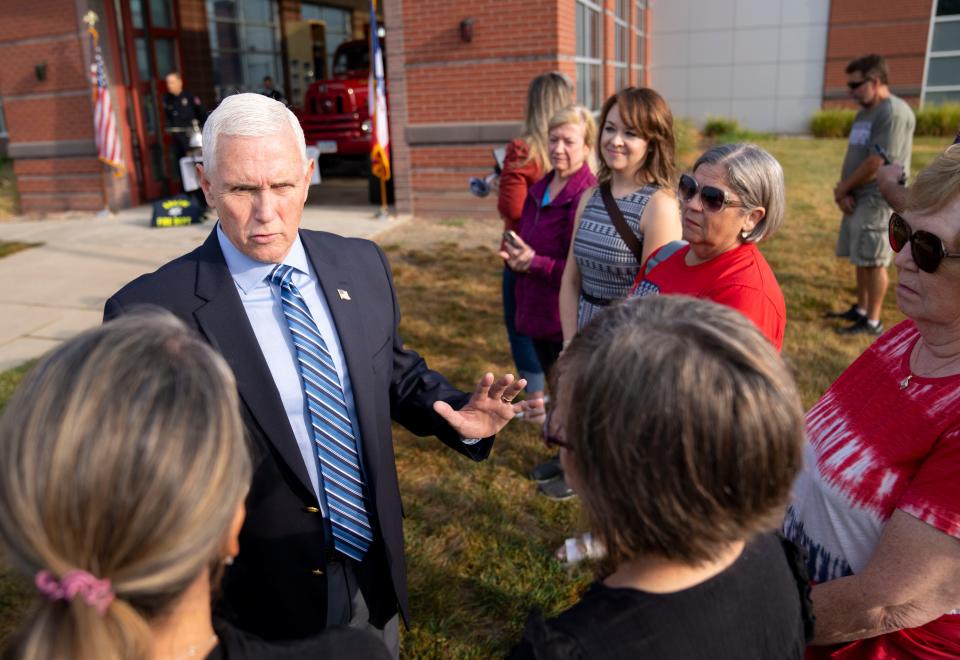 Republican presidential candidate former Vice President Mike Pence talks with attendees during a 9/11 remembrance ceremony at the Ankeny Fire Department, Monday, Sept. 11, 2023.