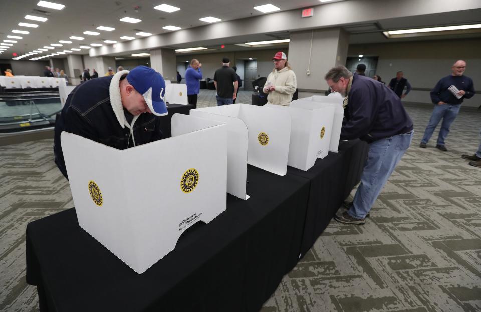 UAW Local 862 members cast their ballots on the vote to ratify a Ford contract at the Galt House in Louisville, Ky. on Nov. 12, 2023.