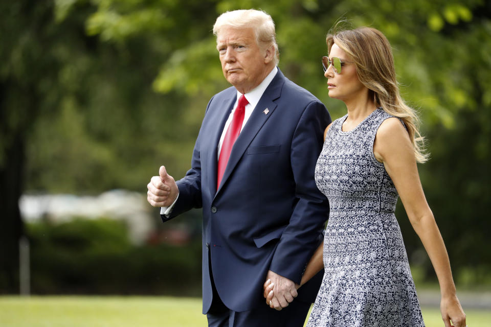 President Donald Trump and first lady Melania Trump walk on the South Lawn of the White House in Washington, Wednesday, May 27, 2020, before boarding Marine One for a short trip to Andrews Air Force Base, Md. Trump is traveling to Kennedy Space Center, Fla., for the launch of a rocket ship built by the SpaceX company, putting NASA back in the business of launching astronauts from U.S. soil for the first time in nearly a decade. (AP Photo/Andrew Harnik)