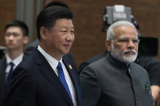 Chinese President Xi Jinping and Indian Prime Minister Narendra Modi, pictured at the 2017 BRICS Summit in Xiamen, will meet again Friday for an "informal summit" in the central Chinese city of Wuhan