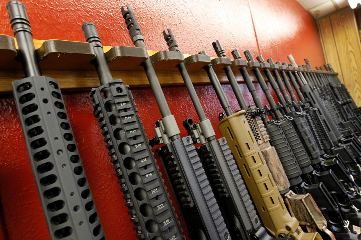 A row of rifles for sale is on display at a gun shop in Aurora, Colorado.