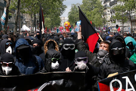 Masked demonstrators gather ahead of labour unions at the traditional May Day labour march in Paris, France, May 1, 2017. REUTERS/Gonzalo Fuentes