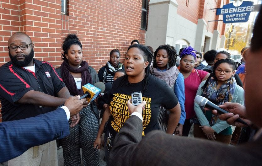 Mary Hooks, with black T-shirt, speaks in front of Ebenezer Baptist Church in Atlanta, Georgia. Hooks is a key leader in the city's Black Lives Matter chapter.