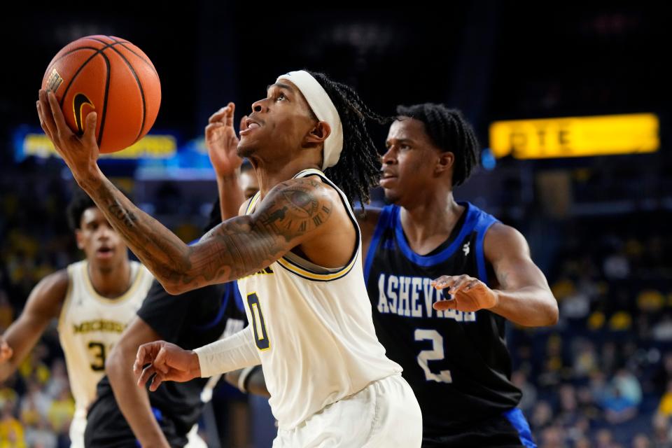 Michigan guard Dug McDaniel makes a layup during the second half of U-M's 99-74 win on Tuesday, Nov. 7, 2023, at Crisler Center.