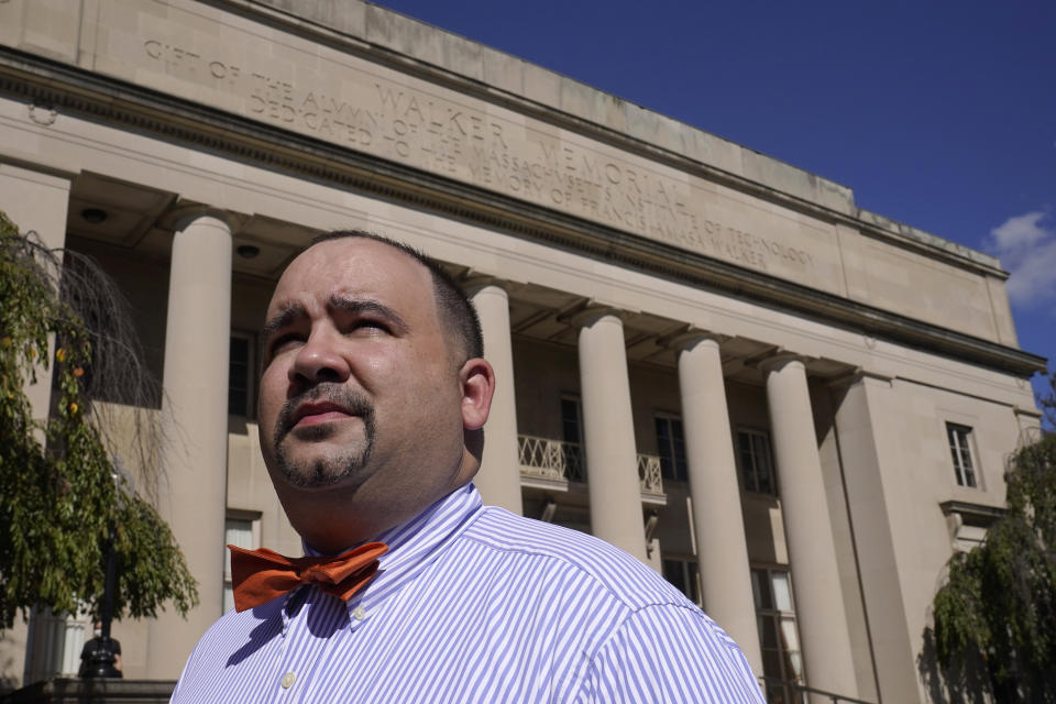 David Shane Lowry, distinguished fellow in Native American Studies at Massachusetts Institute of Technology, stands for a photograph, Thursday, Oct. 7, 2021, in front of the Walker Memorial building on the schools campus, in Cambridge, Mass. MIT is grappling with the legacy of one of its founding fathers, whose name graces the iconic building. Francis Amasa Walker was a former head of the U.S. office of Indian Affairs who authored The Indian Question, a notorious treatise on Native Americans that helped justify the nation's tribal reservation system. (AP Photo/Steven Senne)