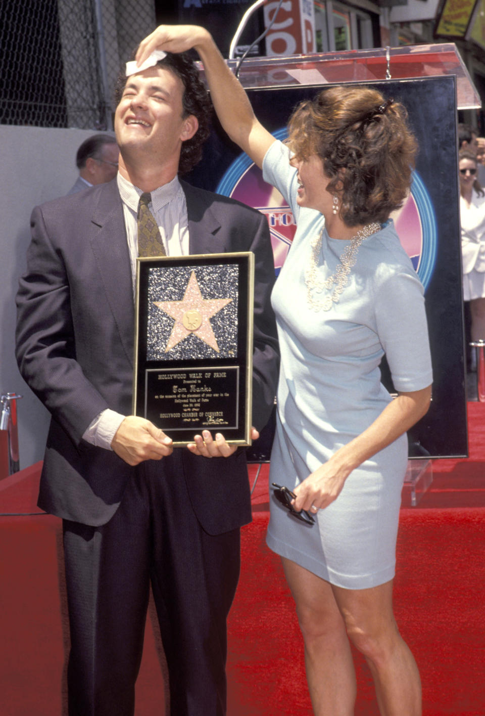 Wilson dabs Hanks’s forehead when he receives a star on the Hollywood Walk of Fame in 1992. (Photo: Ron Galella/WireImage)