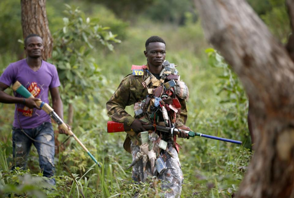 Members of Anti-balaka, a Christian militia, patrol outside village of Zawa