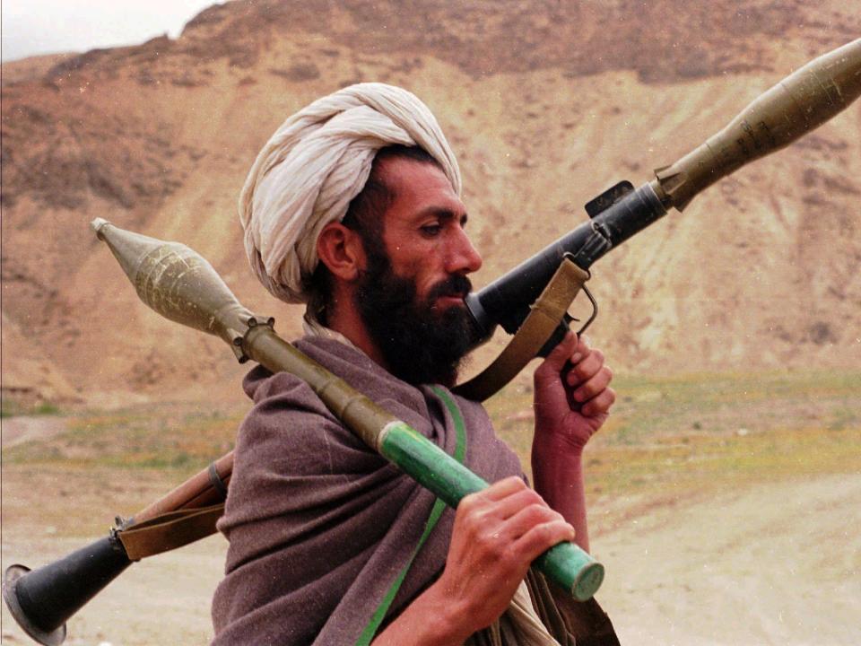 A Taliban fighter holds a RPG7 on his shoulder.